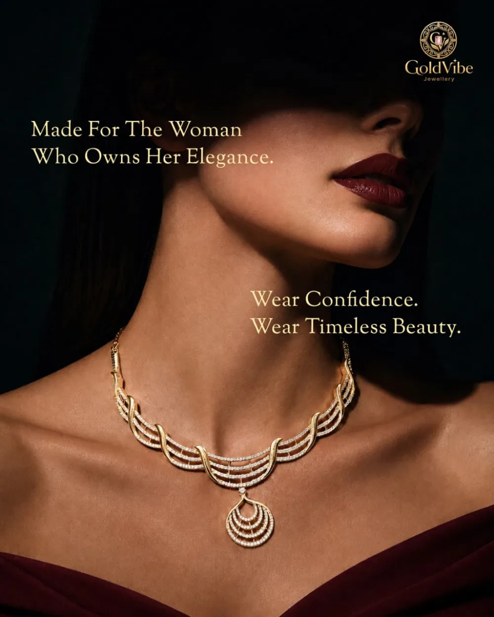 A woman wearing a layered GoldVibe necklace with a teardrop pendant, lit against a dark ground.