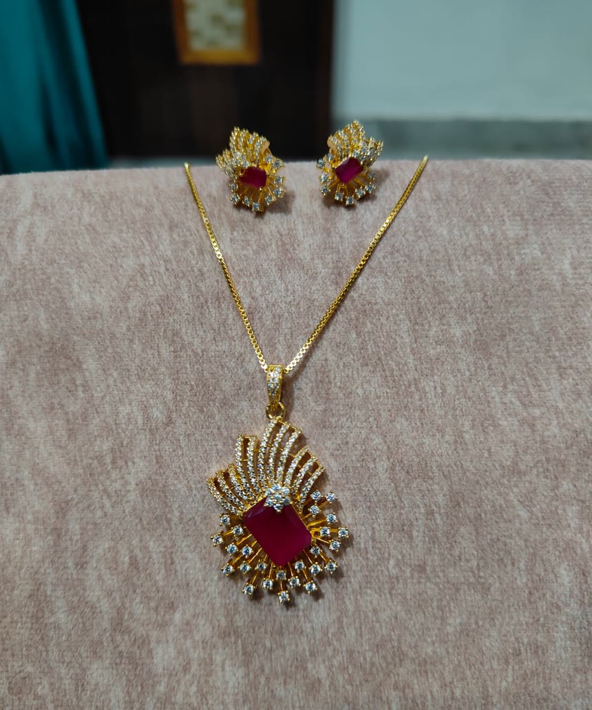 Rani Ruby Pendant Set — A ruby-red stone in a spray of American diamonds — pendant and studs, at the counter now.